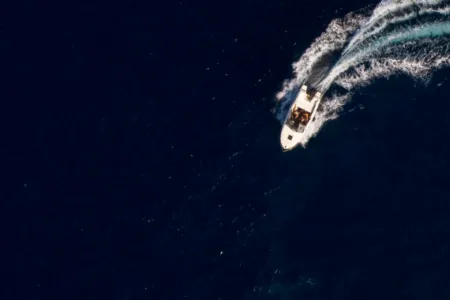 top down view of a powerboat pulling a u turn