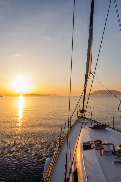 Yacht on the sea at sunset