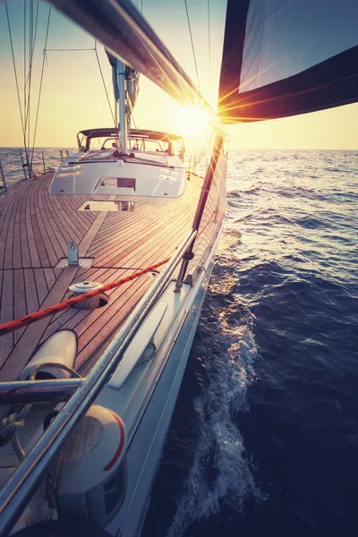 Sailboat deck at sunset on the open sea