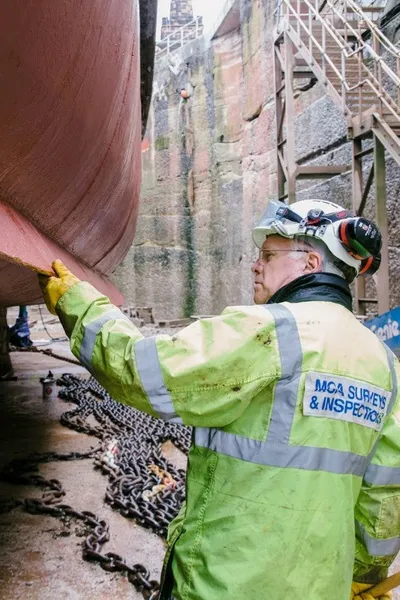 Maritime and Coastguard Agency survey and inspection team inspecting a ship