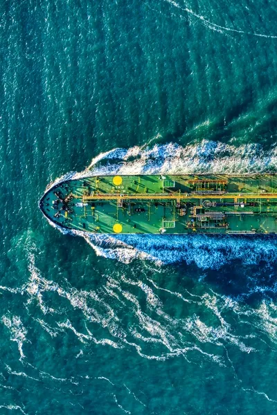 Top-down view of large merchant vessel underway at sea