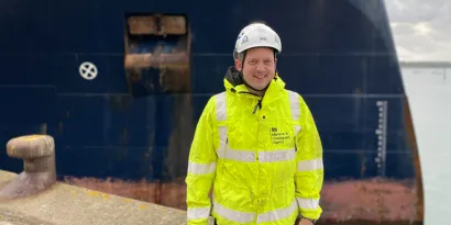 Survey and Inspection Technical Manager, Chris D’Alcorn, standing in front of a vessel