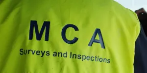 Back view of a Surveyors jacket. Text reads MCA Surveys and Inspections.