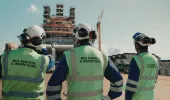 Three MCA surveyors looking at ship