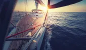 Sailboat deck at sunset on the open sea