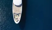 Aerial view of large yacht with helipad