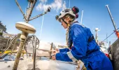 Female maritime surveyor conducting an inspection on a domestic vessel